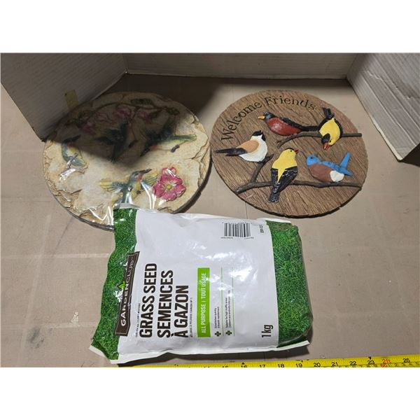 Stepping stone , sign and grass seed