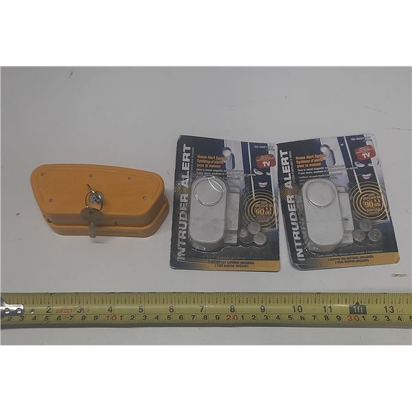 Mossberg Firearm Safety Lock and (2) Intruder House Alert System.