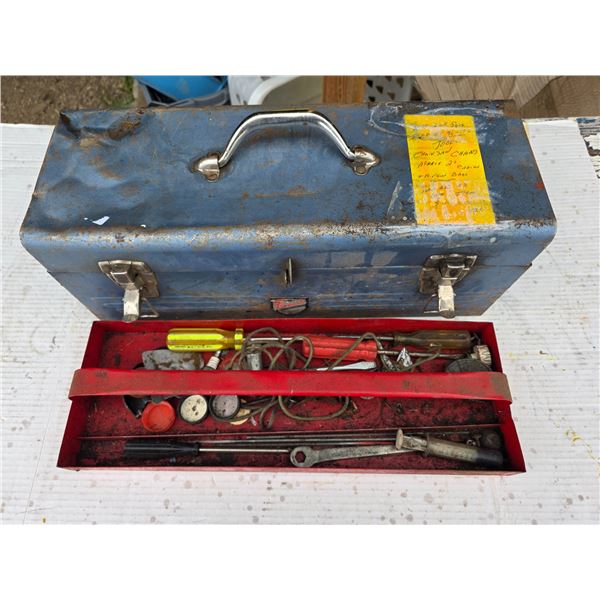 Tool box with chainsaw chains and misc tools