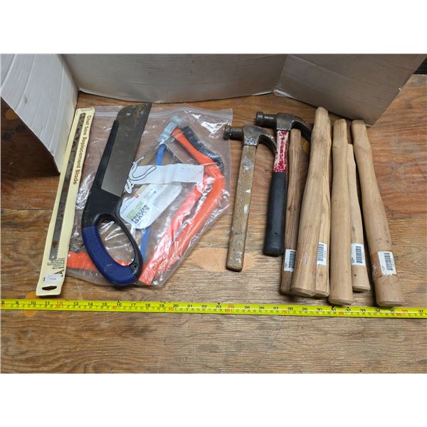 Lot of hammers, saws and handles