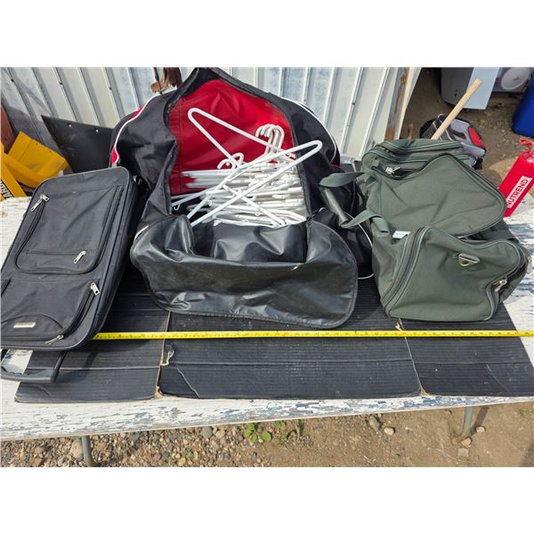 3 travel bags and hangers