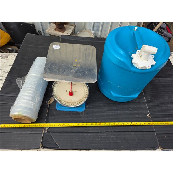 Scale, water jug and saran wrap
