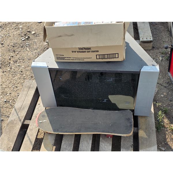 Tv stand, skate board and christmas lights