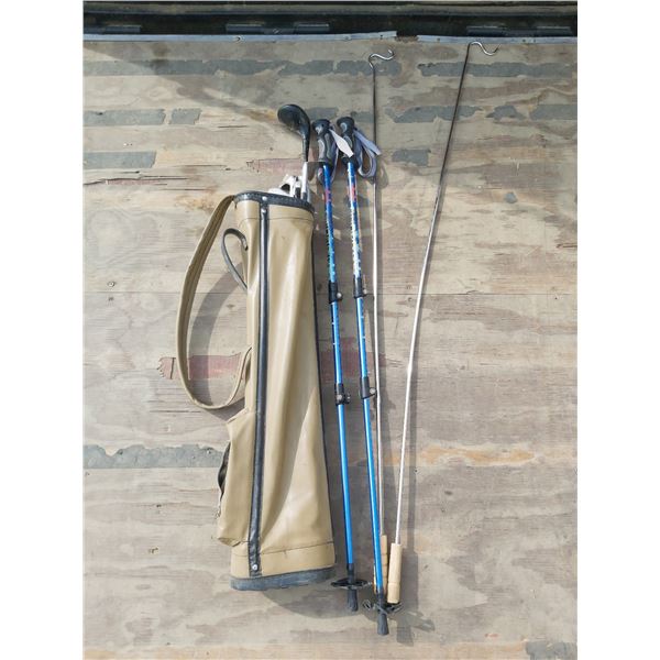 Vintage golf bag with clubs/Blue trekking poles/Metal roasting sticks