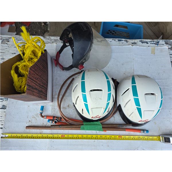Copper pipes, helmets and rope