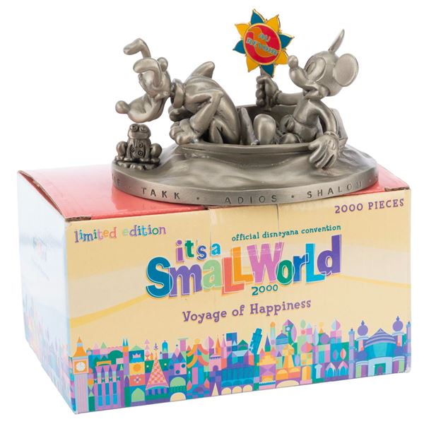 An It’s a Small World "Voyage of Happiness” Figurine.