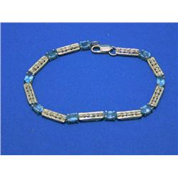 10k Gold Blue Topaz Tennis Bracelet