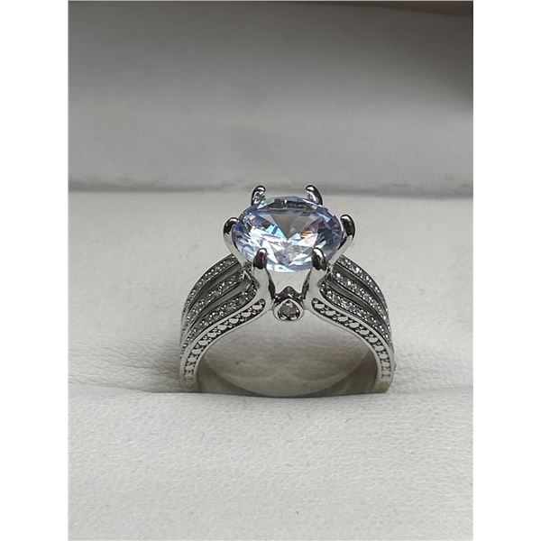 Silver-Tone Ring With Clear Center Stone and Side Accents