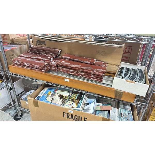SHELF OF ASSORTED MODEL TRAIN RAILWAYS INCLUDING; HO SWITCH, CORNERS, STRAIGHT-AWAYS & DISPLAY CASE