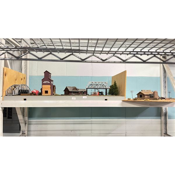 SHELF OF MODEL TRAIN SCENIC STRUCTURES