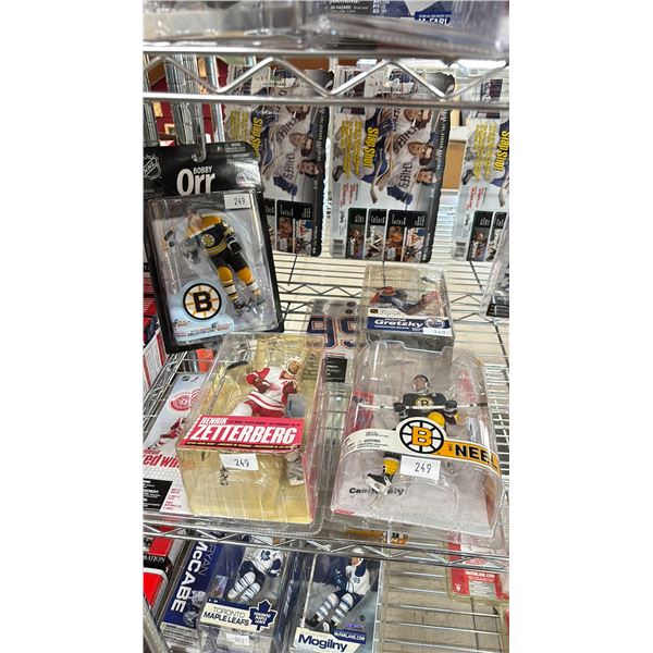 FOUR NHL ACTION FIGURES - WAYNE GRETZKY, BOBBY ORR, HENRIK ZETTERBERG & CAM NEELY