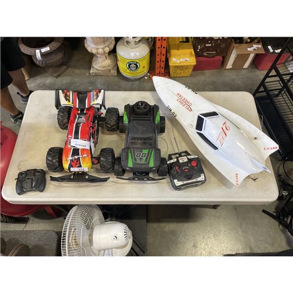 RC BOAT AND 2 MONSTER TRUCKS, ONE IS MISSING REMOTE