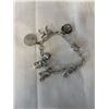 Image 1 : VINTAGE STERLING SILVER CHARM BRACELET MARKED STG