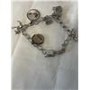 Image 2 : VINTAGE STERLING SILVER CHARM BRACELET MARKED STG
