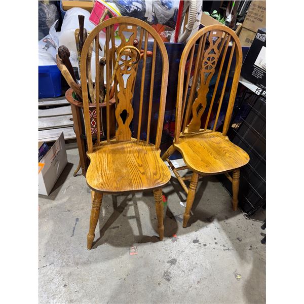 Two high back wood chairs