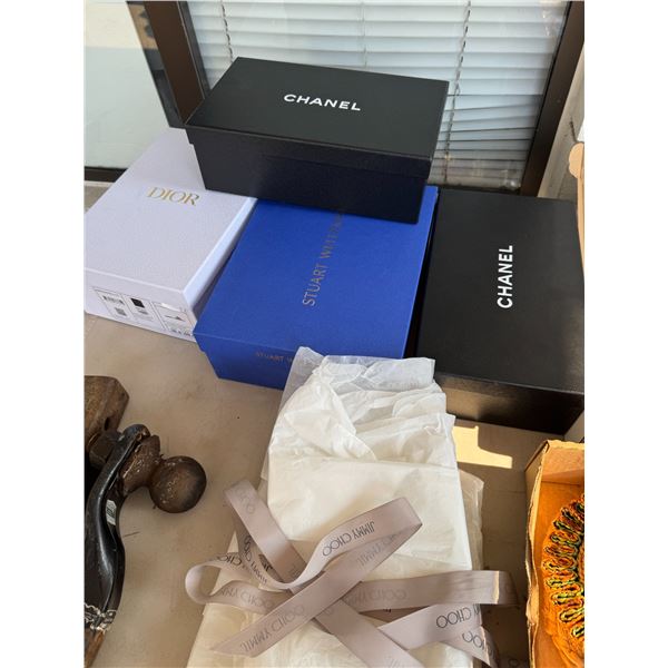 Brand-name shoeboxes with tissue paper, etc.