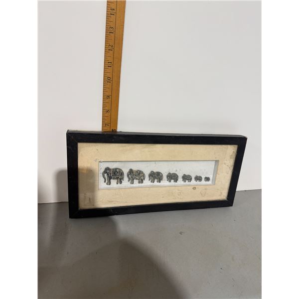 Curved elephant wall hanging