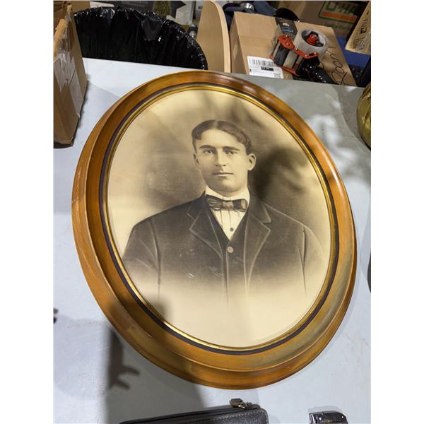 Oval framed wall hanging