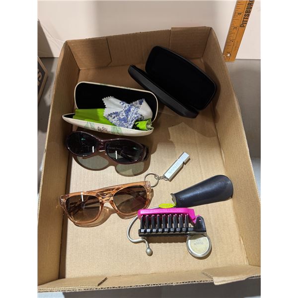 Sunglasses holding brush and shoe horn