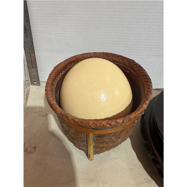 Ostrich egg in basket