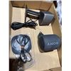 Image 1 : Bose speaker, Sony speaker, and wireless charger