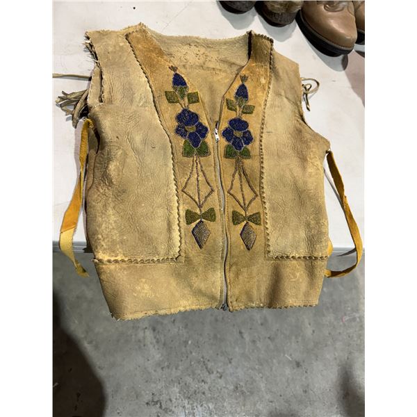 Beaded leather vest one children needs repair
