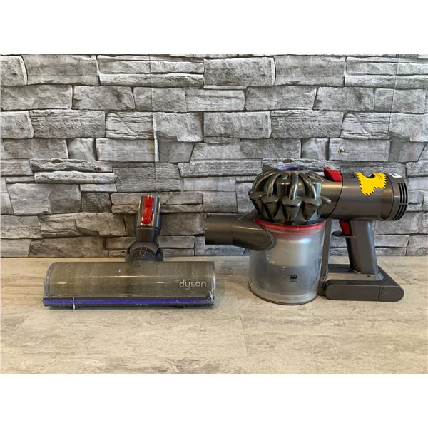 Dyson Rechargeable Vacum With Attatchments - Turns on and Sucks