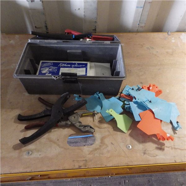 Cattle ear tags and pliers