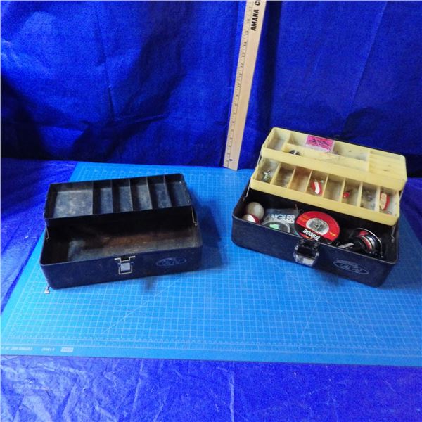 two tackle boxes one has some tackle in it