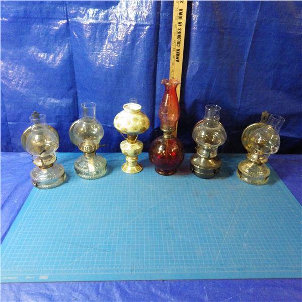 lot of miniature coal oil lamps