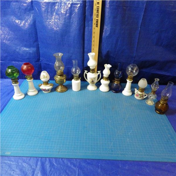 lot of miniature coal oil lamps