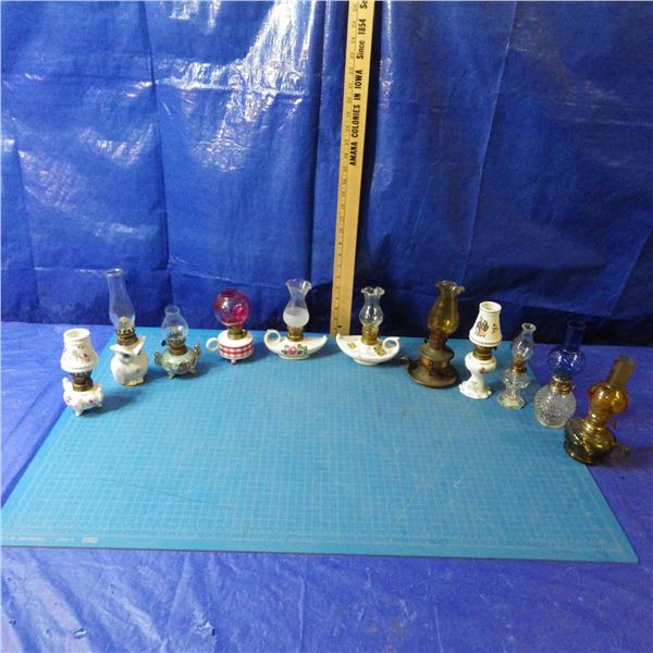 lot of miniature coal oil lamps