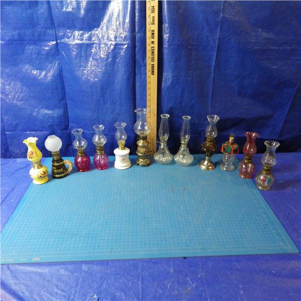 lot of miniature coal oil lamps