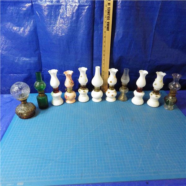 lot of miniature coal oil lamps