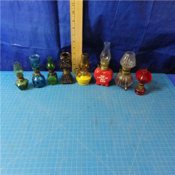 lot of miniature coal oil lamps