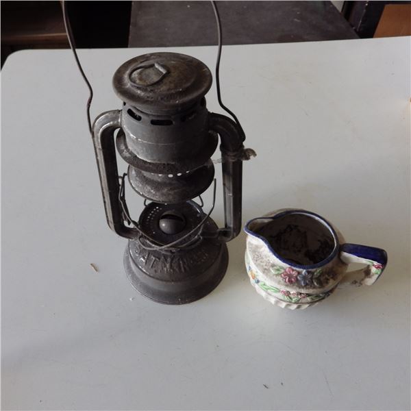 Barn Lantern and vintage pitcher looks like it was Used as a plant pot