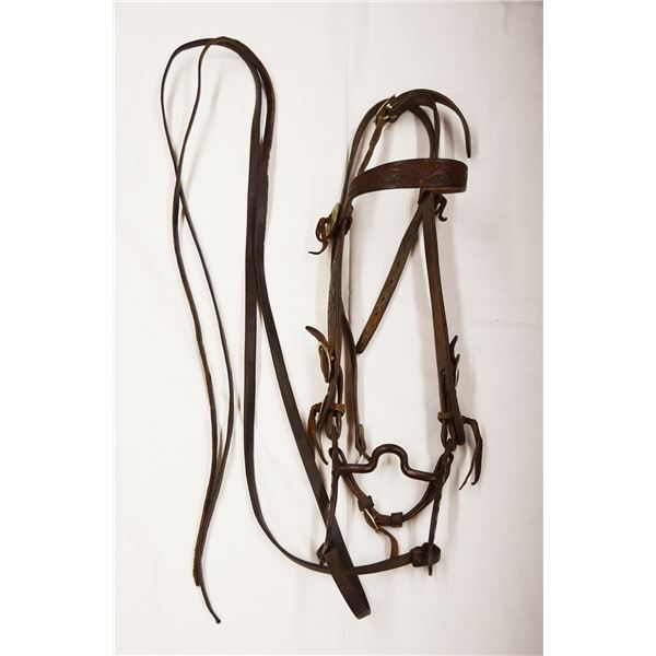 Crockett silver mounted bit, in flower tooled bridle, carries small mark