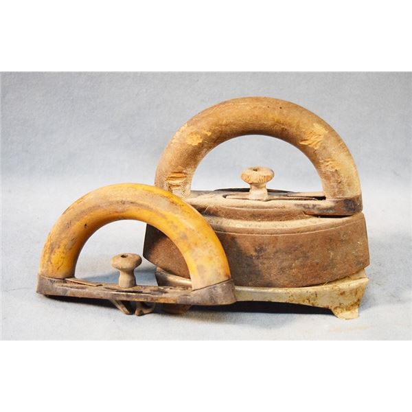 Colebrookedale Iron Co., Boyertown, PA, sad iron with two wooden handles and trivet, 7" tall