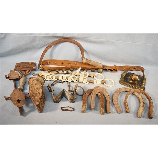 Assortment of barn related finds - horse shoes, mule shoes, ice skate, studded blinder, milking hobb