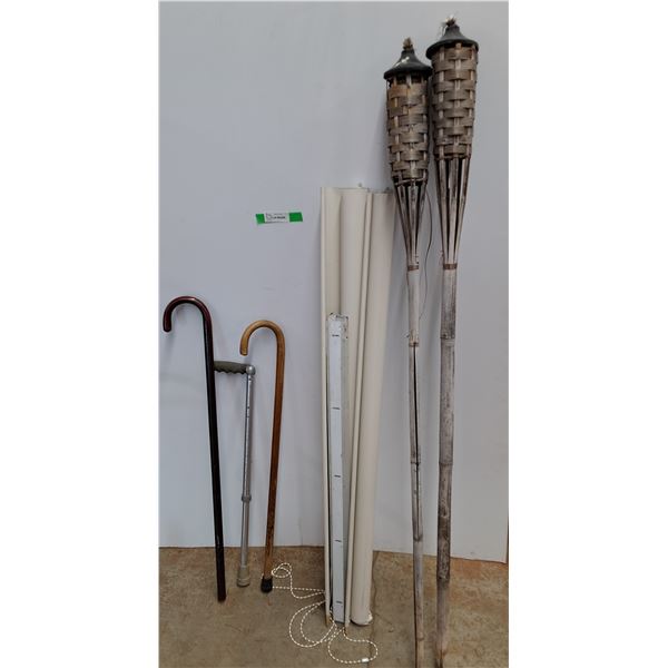*(2) Canes-One Adjustable Up to 37", (2) Tiki Torches, (2) Rolling Blinds 27" Wide- Cannot Ship