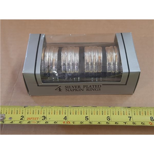 4 Silver Plated Napkin Rings.