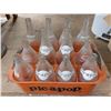 Image 1 : Collection of vintage Pic-A-Pop soda bottles in an orange crate