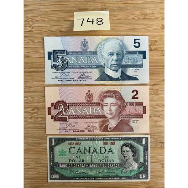 Canadian $5, $2, and $1 bills.