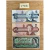 Image 1 : Canadian $5, $2, and $1 bills.