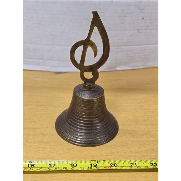 Brass bell with musicial note