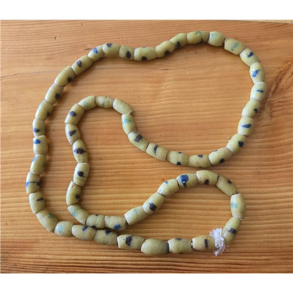 One Forty Inch Strand of Antique Yellow Sand Cast Beads