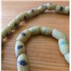 Image 2 : One Forty Inch Strand of Antique Yellow Sand Cast Beads