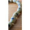 Image 4 : One Forty Inch Strand of Antique Yellow Sand Cast Beads