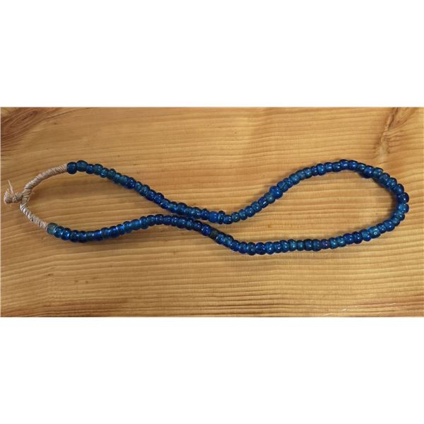One 24” Strand of Antique Translucent Blue Padre Beads