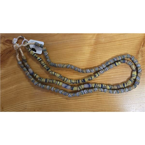 Two 24” Antique Venetian Yellow Sand Cast Trade Beads